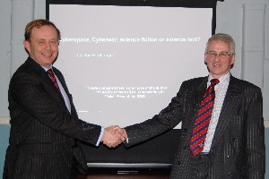 Russell Searle (l), chapter president, thanks Lt. Col. Ian Buchanan, British Army, of the Cyber and Influence Science and Technology Centre at Porton Down, for his presentation in March.